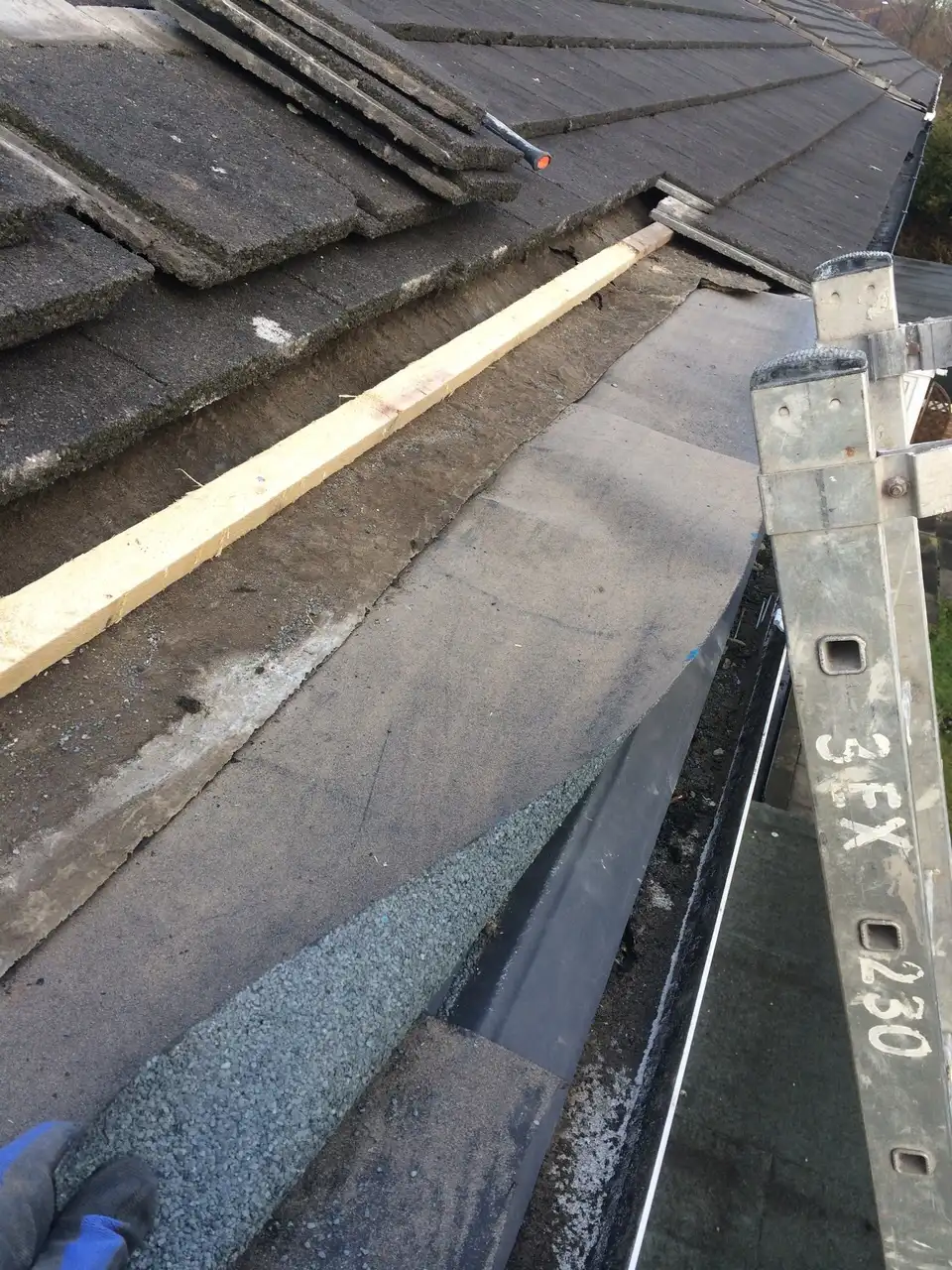 Roof repair work showing tiles, battens and underlay