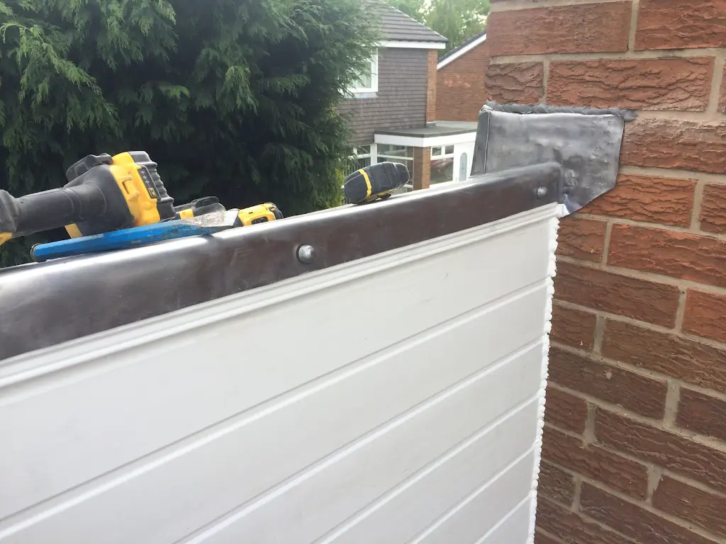 Lead flashing detail where roof meets brickwork
